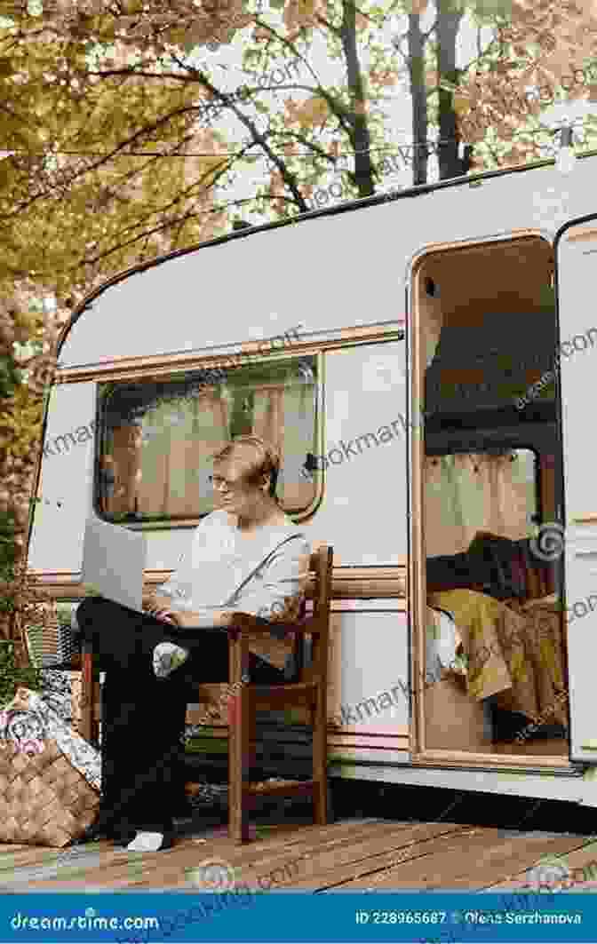 A Man And Woman Sitting At A Table In An RV, Working On Their Laptops Full Time RV Living: What I Wish I Had Known 7 Years Ago Before I Hit The Road