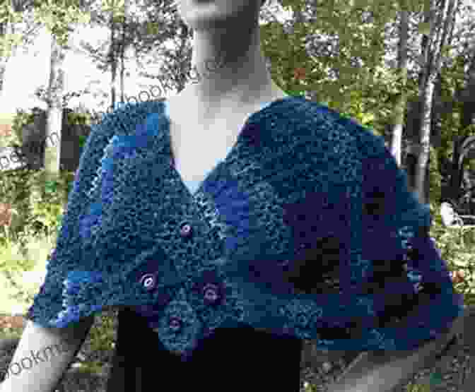 A Model Gracefully Draped In The Indigo Impressions Wrap Shawl, Showcasing Its Intricate Patterns And Elegant Drape, While Standing In A Sunlit Field. Indigo Impressions Crochet Pattern 101 3 In 1 Wrap / Shawl