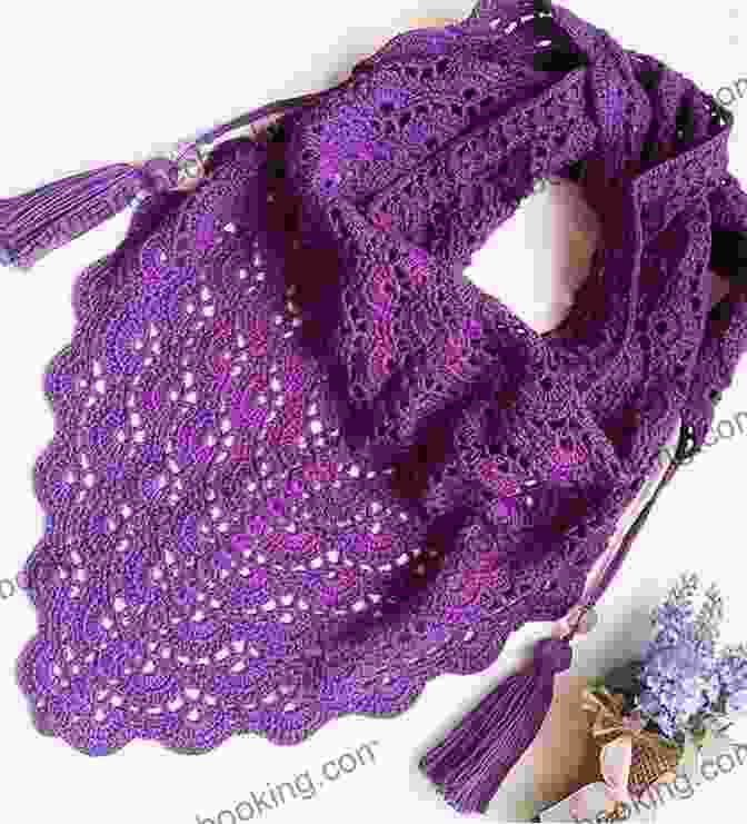 A Vibrant Indigo Wrap Shawl, Crocheted With Intricate Patterns And Adorned With Tassels, Draped Over A Wooden Chair In A Cozy Living Room. Indigo Impressions Crochet Pattern 101 3 In 1 Wrap / Shawl