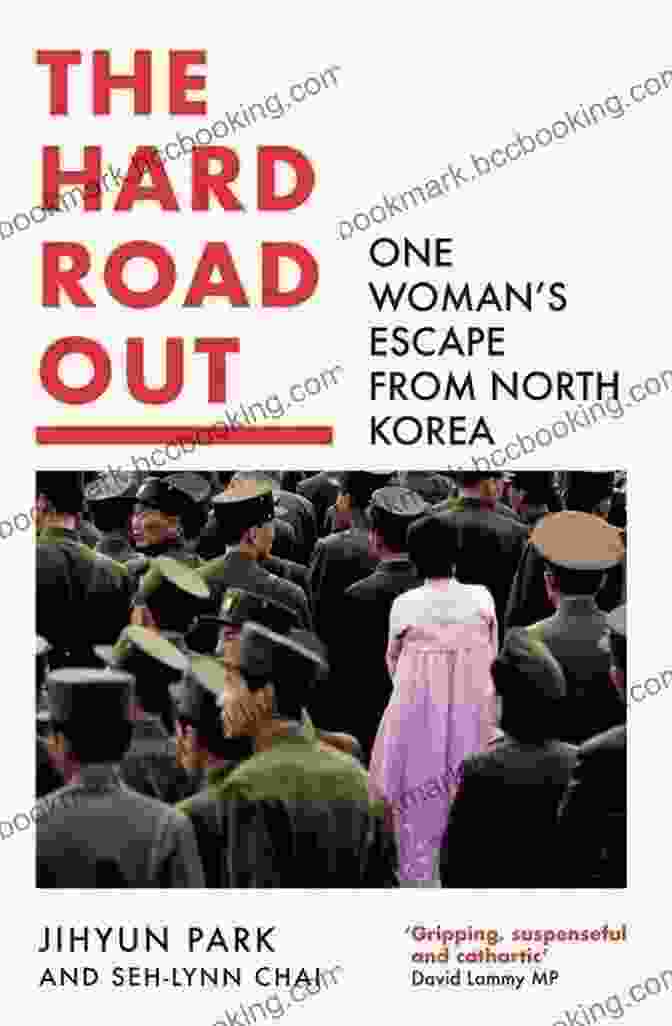 Book Cover Of The Hard Road Out, Featuring A Woman Walking On A Rugged Path With Mountains In The Background The Hard Road Out: One Woman S Escape From North Korea